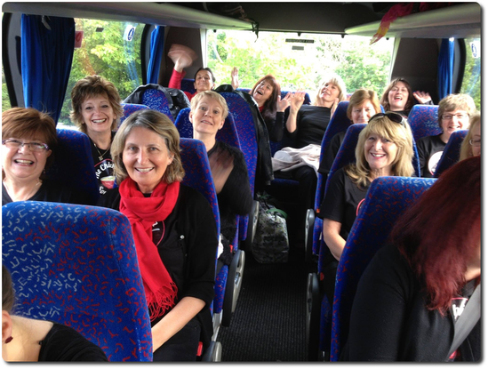 Smiles aplenty on the coach to Mark de Lisser's Sing out Sunday in 2015